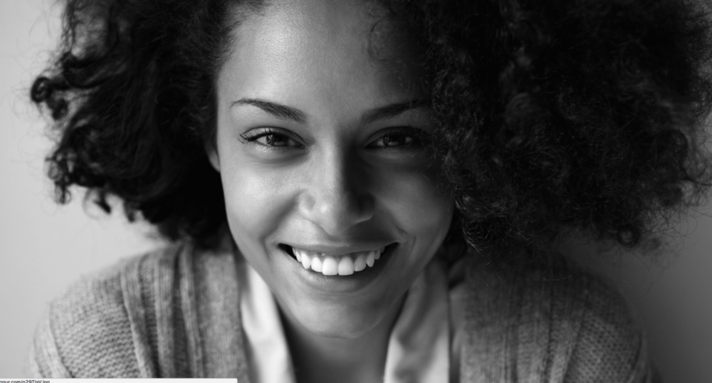 woman smiling after getting dental implants in irvine