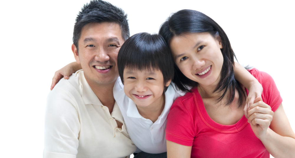 mother, father, and son smiling
