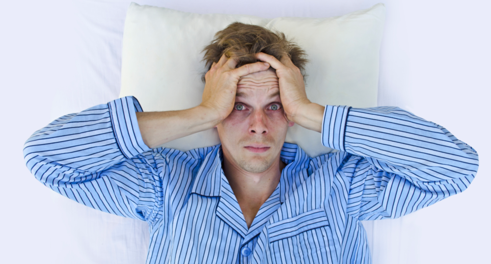 man not sleeping due to sleep apnea