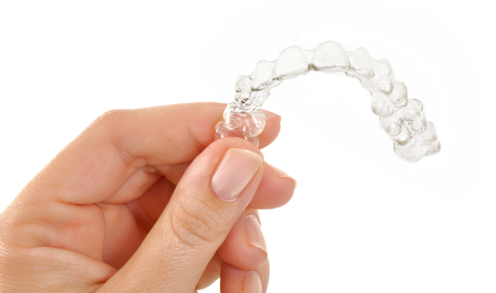 person holding invisalign aligners 