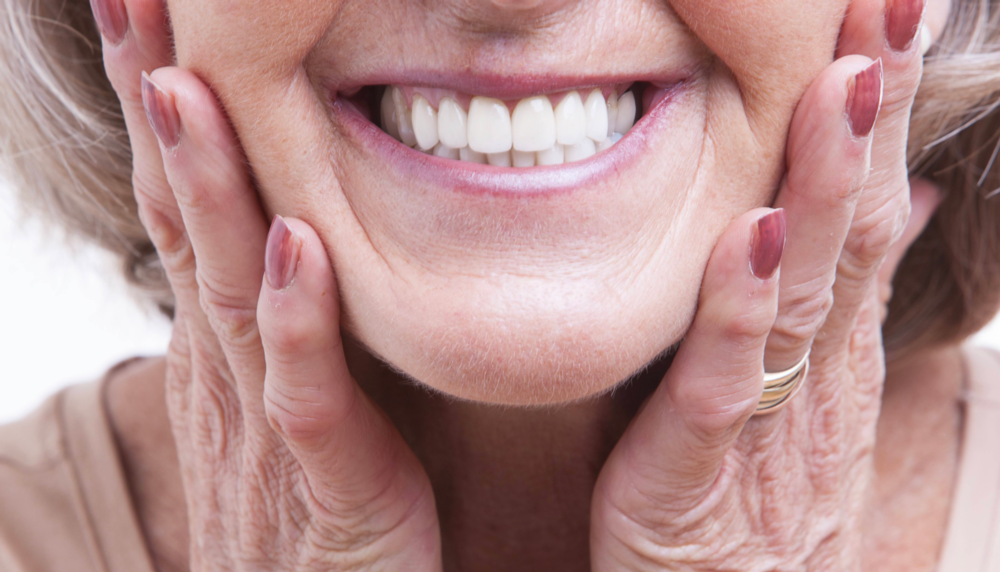 woman smiling after getting gum disease treatment in irvine