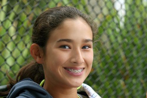 young girl with braces on her teeth