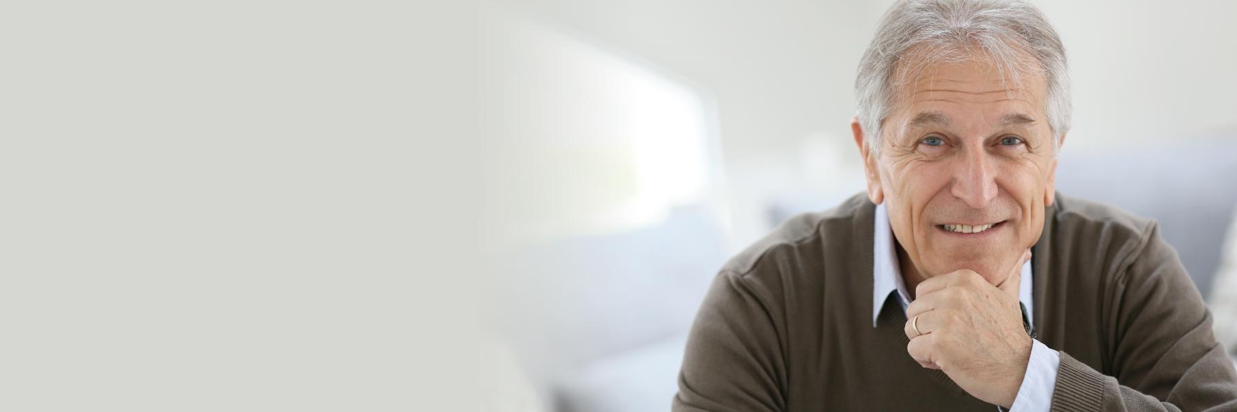 irvine man smiling after getting a dental implant