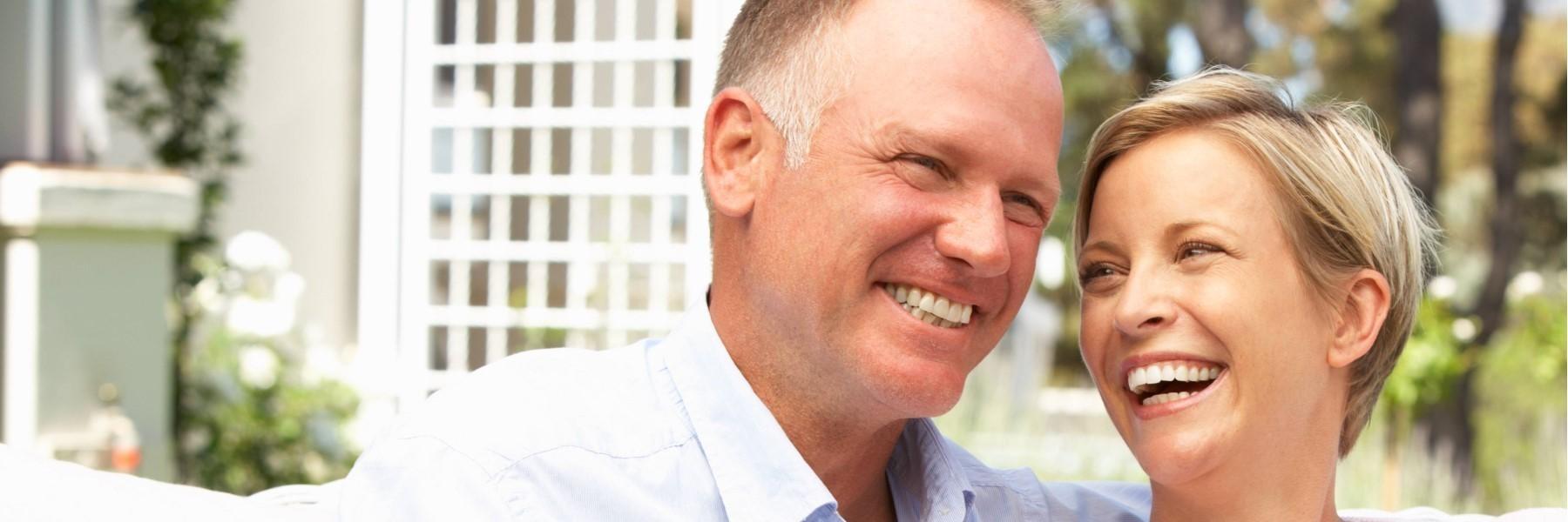 man and woman smiling