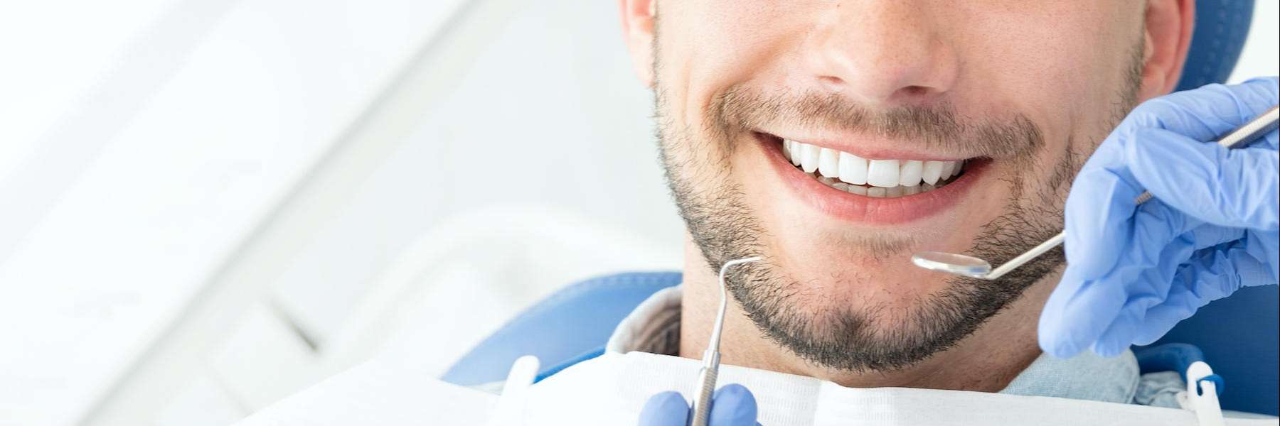 man getting teeth cleaned in irvine